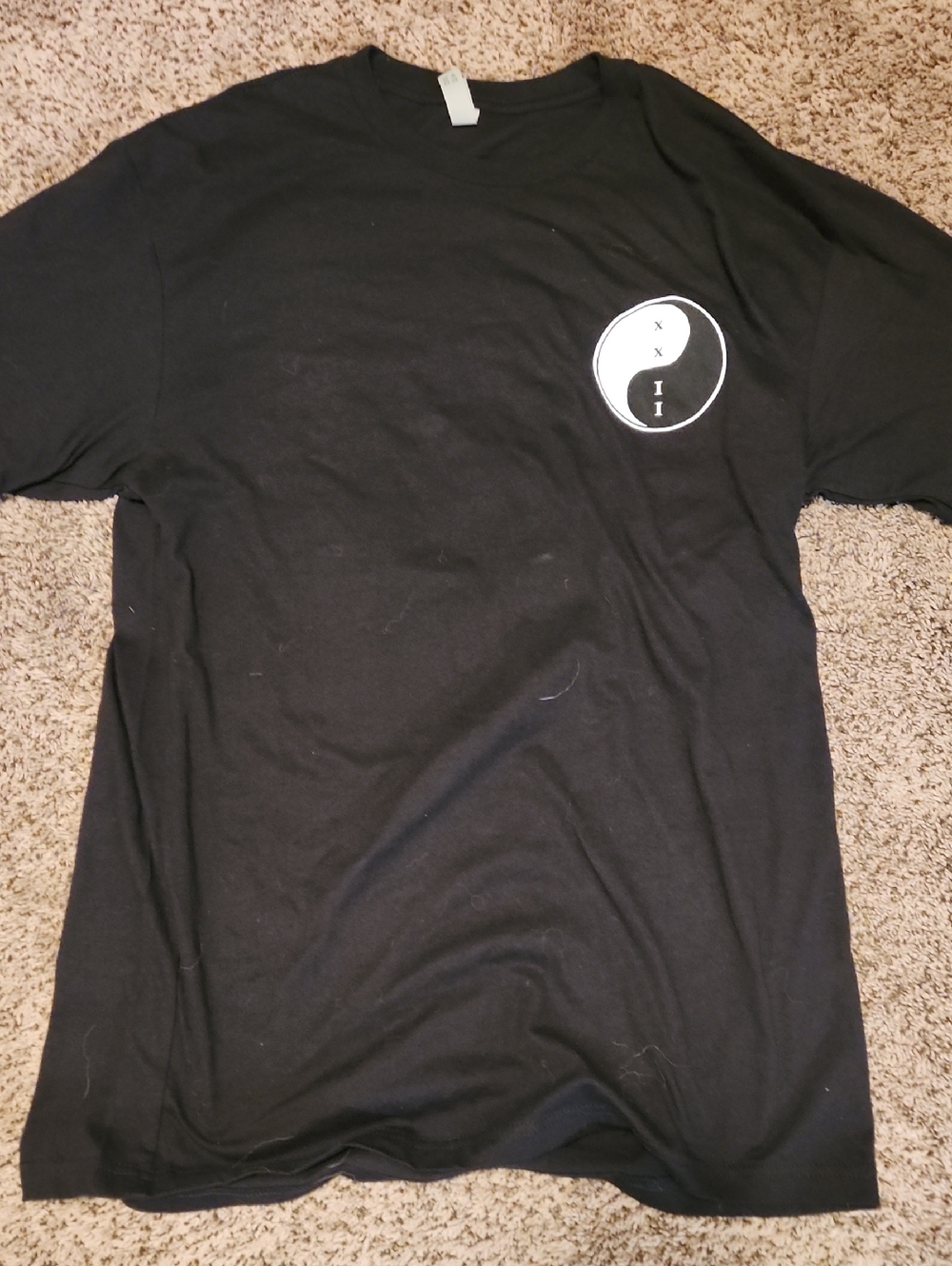 Next Level Apparel Black Tee with White Yin-Yang Chest Graphic